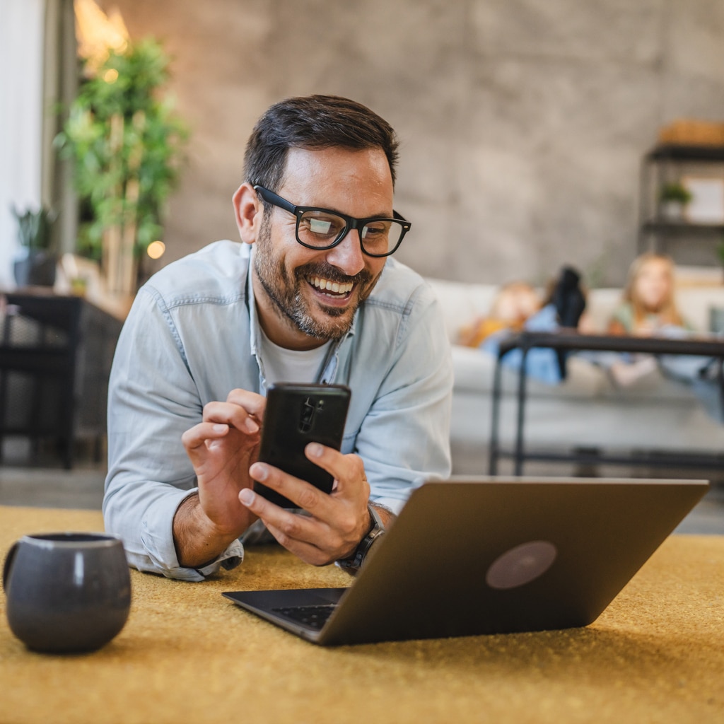Man looking at social media on his phone